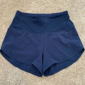 BLUE LULULEMON SHORTS-SIZE 2 4 INCH